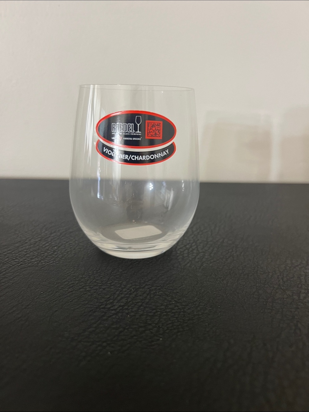 Riedel Stemless Wine Glass with Red and Black Label